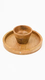 Wooden cup and saucer set on a white background