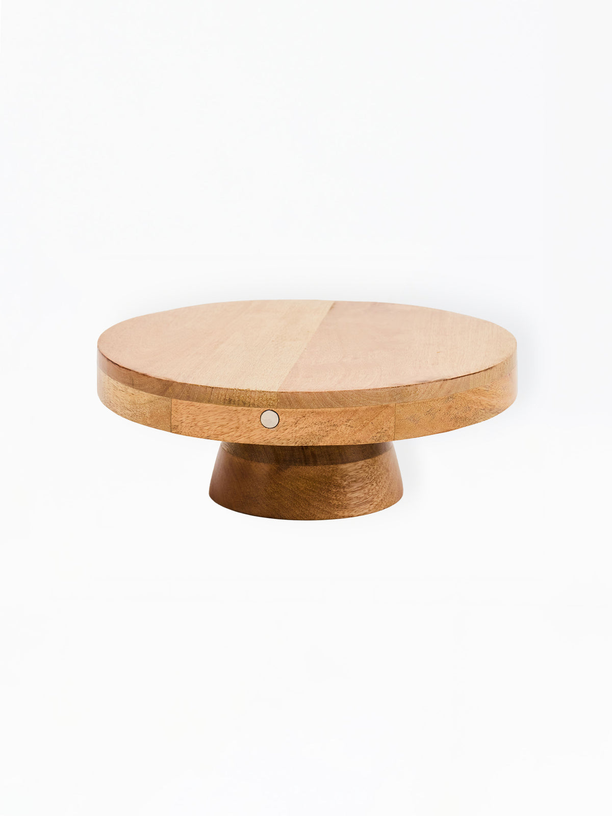 A round wooden cake stand or pedestal table with a light tan top and a darker brown base, shown against a plain white background.