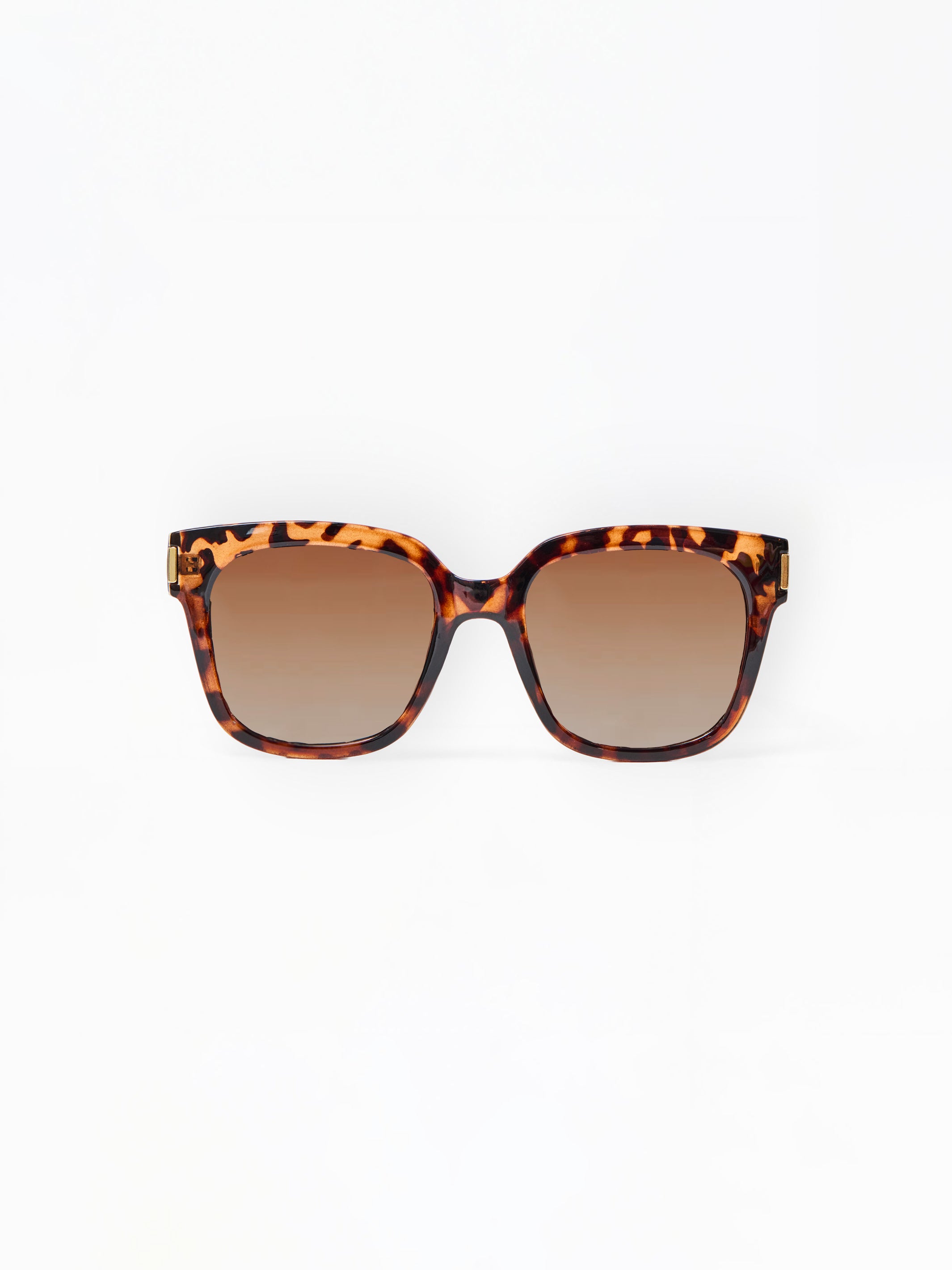 Tortoiseshell sunglasses with brown lenses on a white background