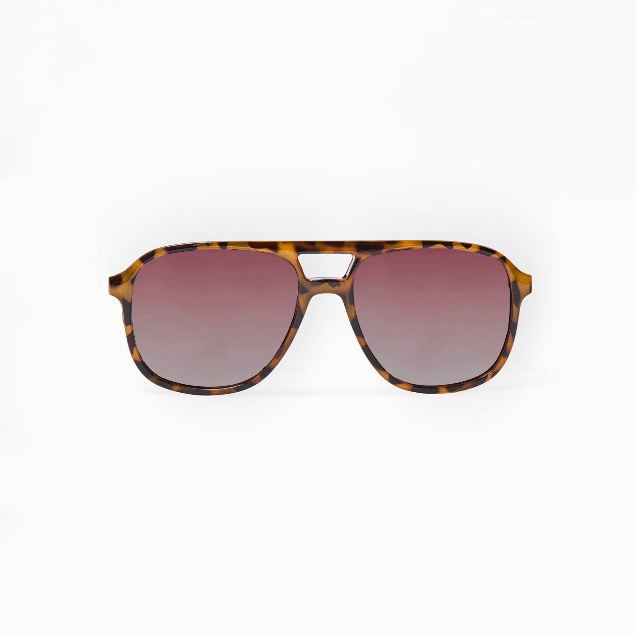 Tortoiseshell sunglasses with pink gradient lenses on a white background