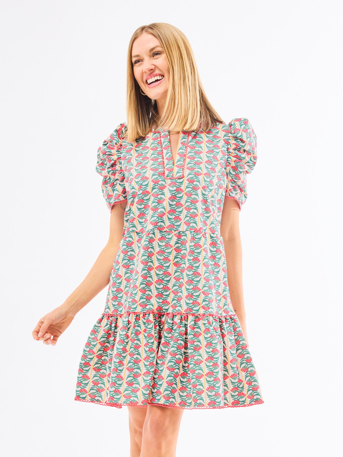 Woman wearing a floral dress on a white background