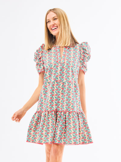 Woman wearing a floral dress on a white background