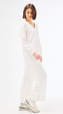 Woman wearing a white set on a white background