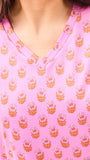 Close-up of a pink pajama shirt with a floral pattern