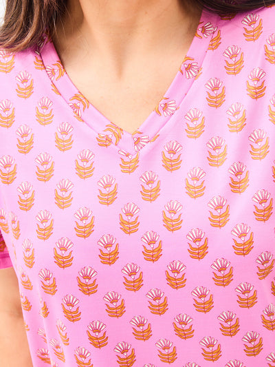 Close-up of a pink pajama shirt with a floral pattern