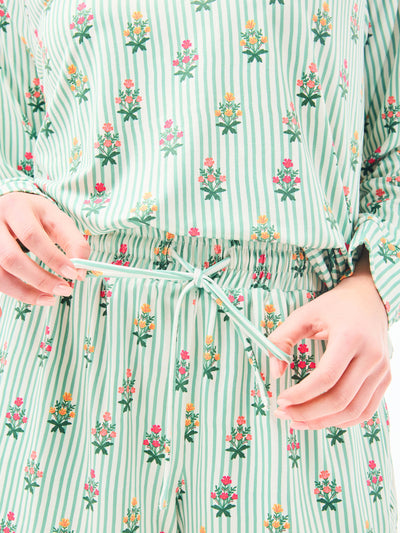 Green and white striped pajama set with floral patterns