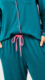 Teal pajama set with pink accents on a white background