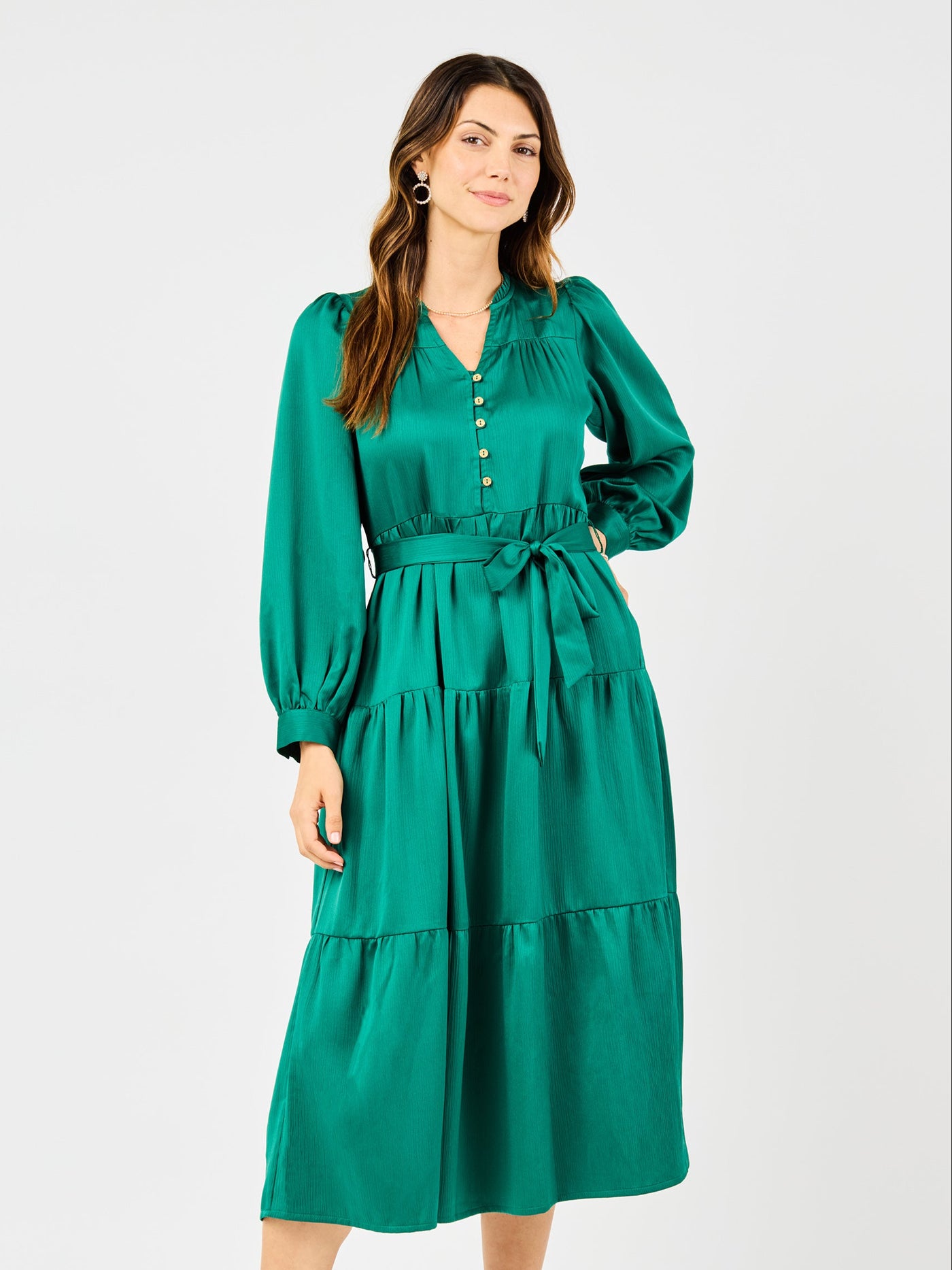 Woman wearing a green dress on a white background