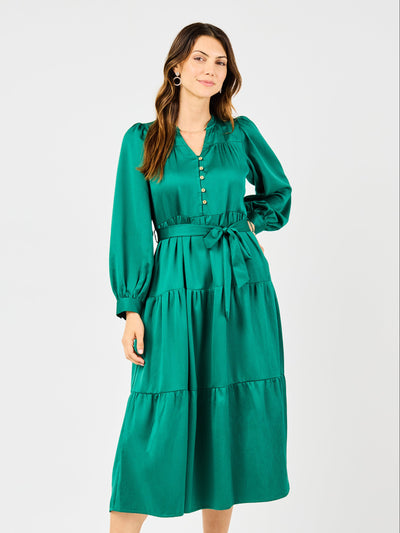 Woman wearing a green dress on a white background