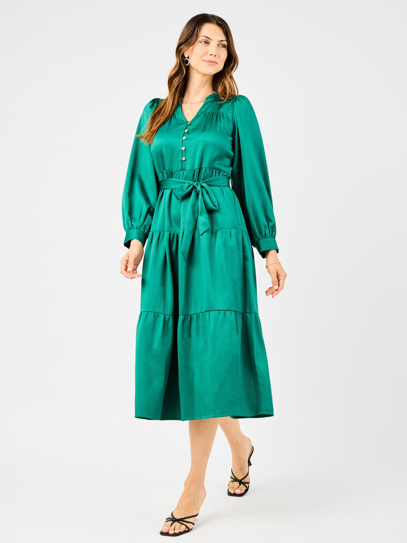 Woman wearing a green dress on a white background