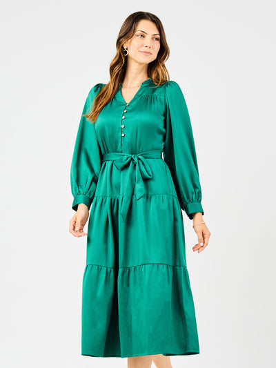 Woman wearing a green dress on a white background