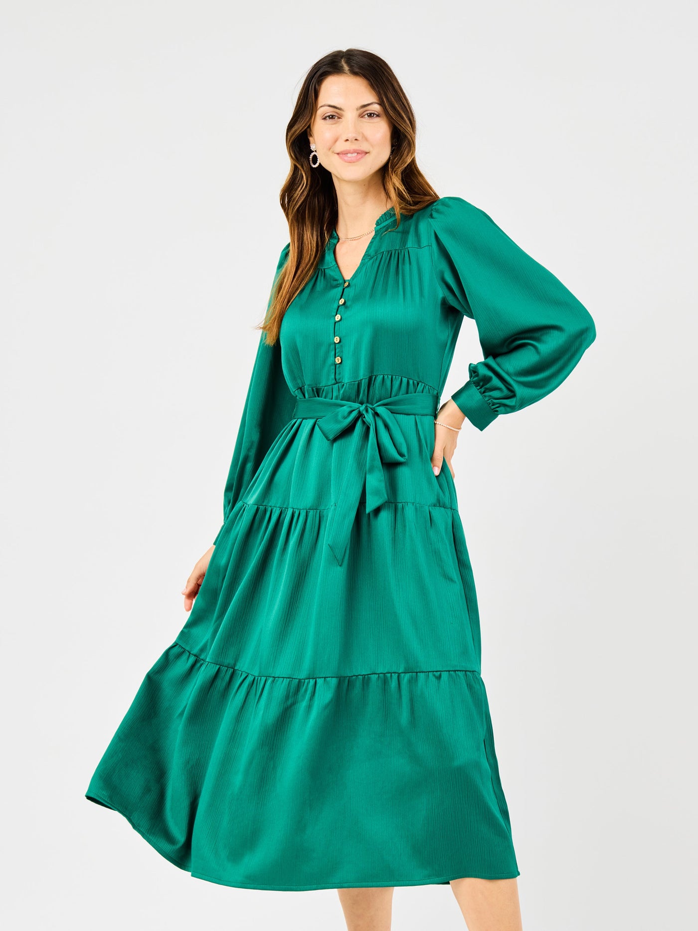 Woman wearing a green dress on a white background