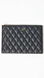 Black quilted pouch with gold zipper on a white background