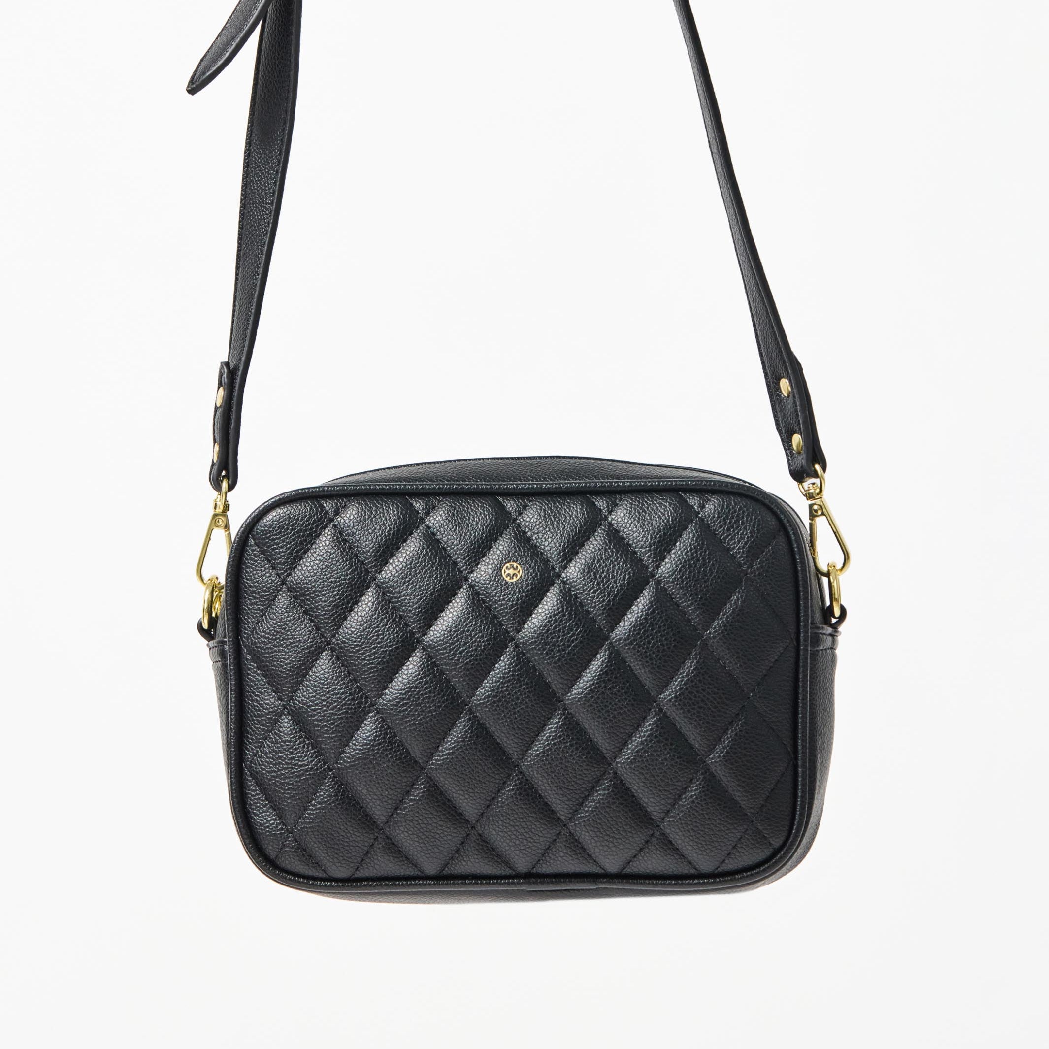 Black quilted crossbody bag on a white background