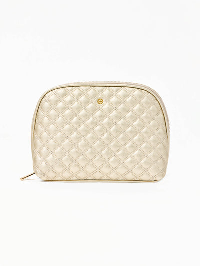 Quilted champagne colored cosmetic bag on a white background