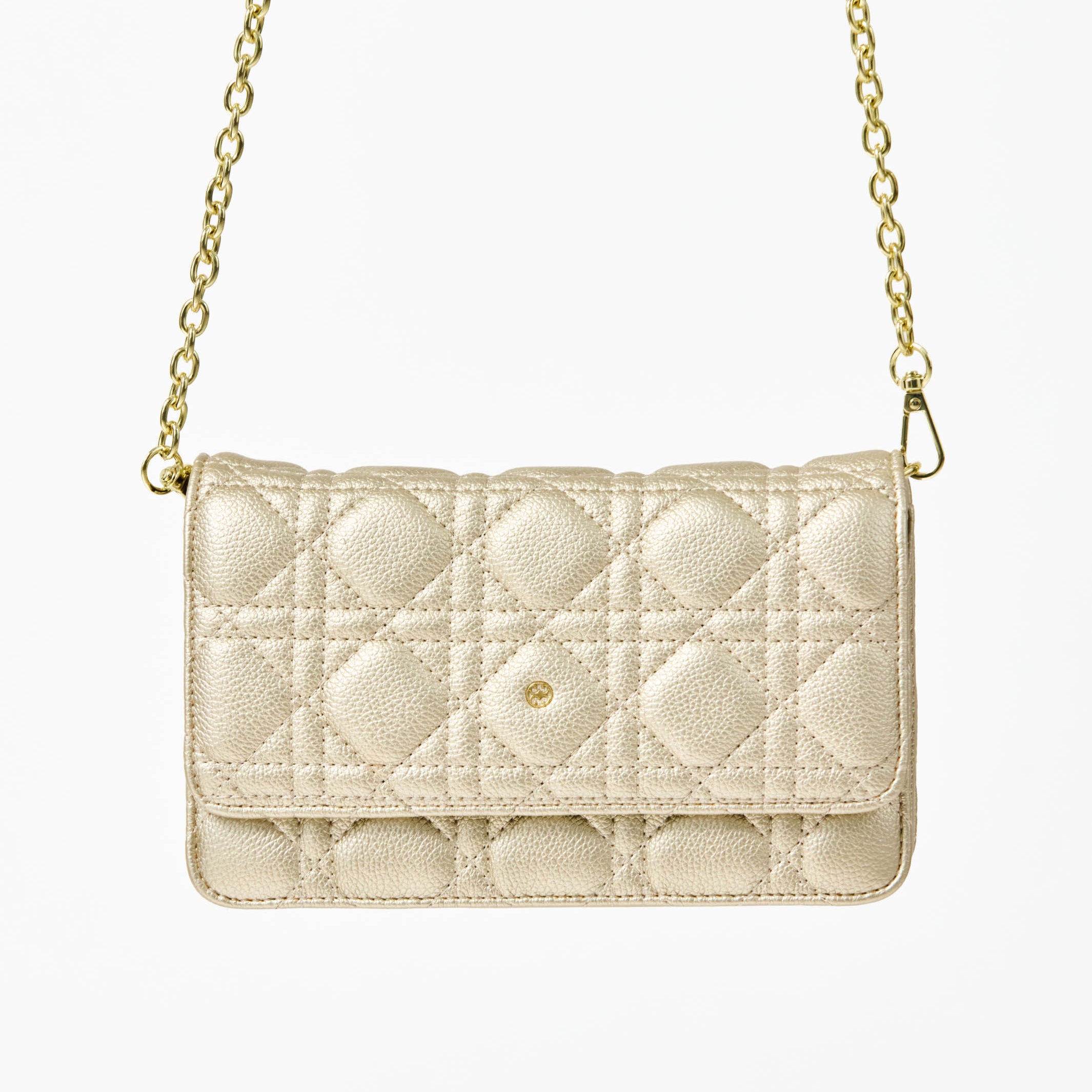 Champagne colored quilted handbag with gold chain strap on a white background