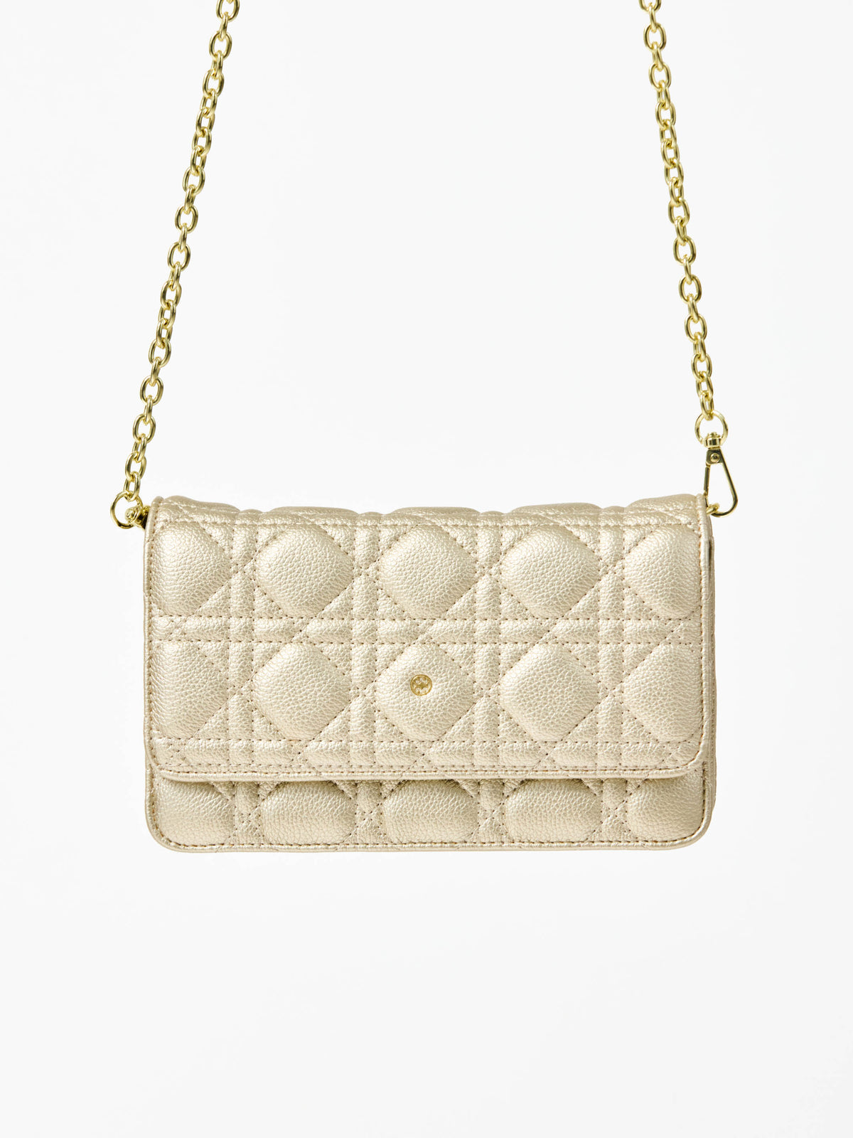 Champagne colored quilted handbag with gold chain strap on a white background