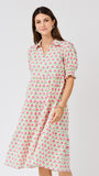 Woman wearing a floral dress on a white background