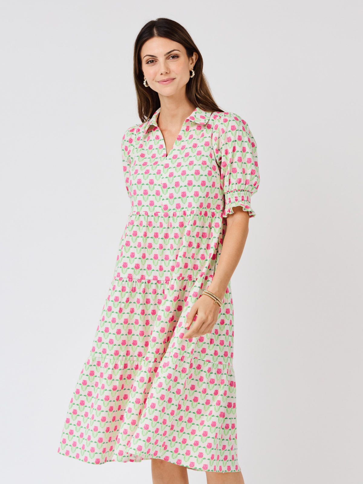 Woman wearing a floral dress on a white background