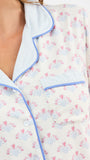 Close-up of a floral patterned pajamas with blue piping