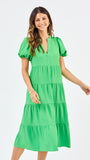 Woman wearing a green dress on a white background