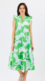 Woman wearing a green and white leaf-patterned dress on a white background