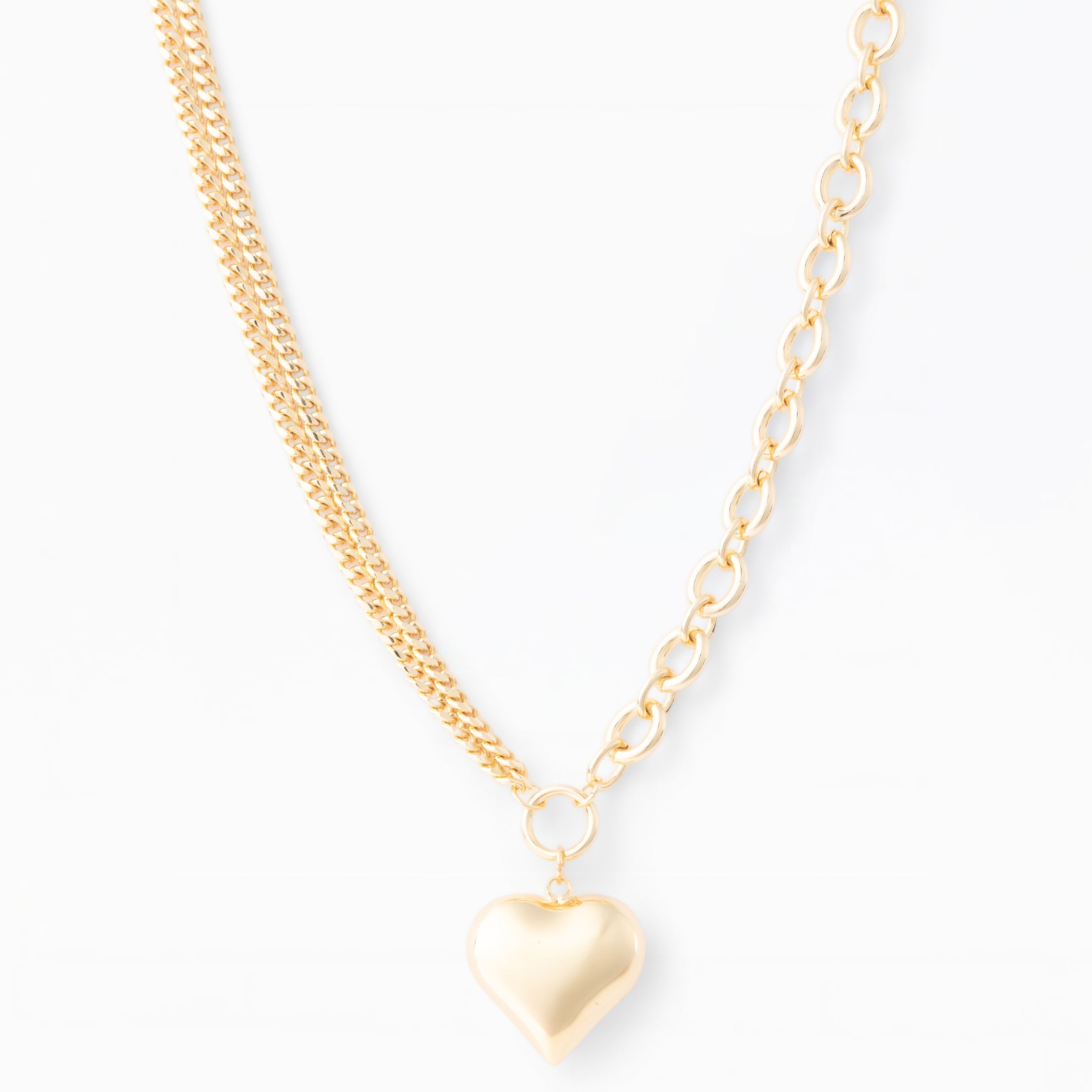 Gold heart-shaped pendant necklace on a white background
