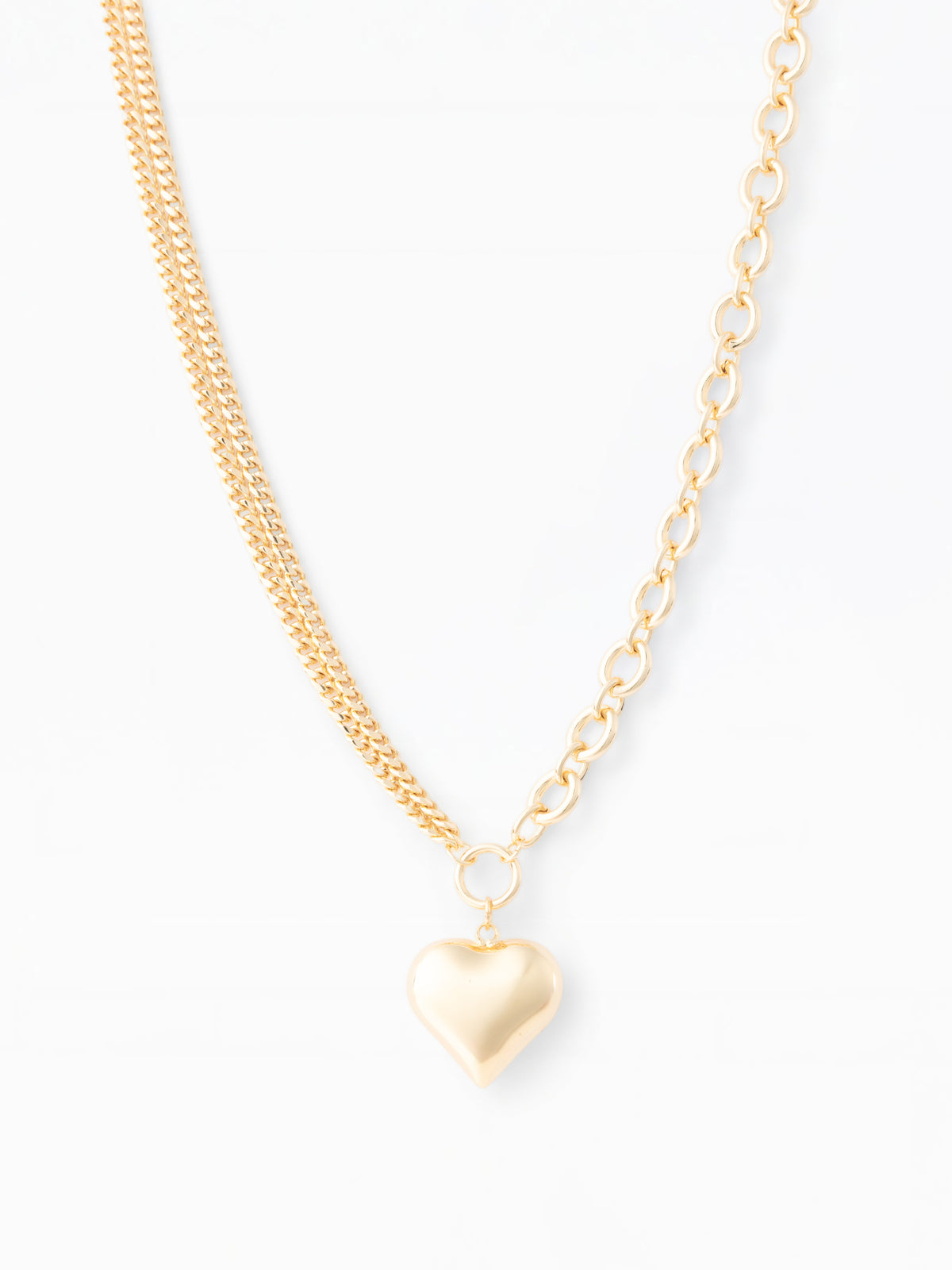 Gold heart-shaped pendant necklace on a white background