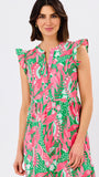 Woman wearing a colorful floral dress on a white background