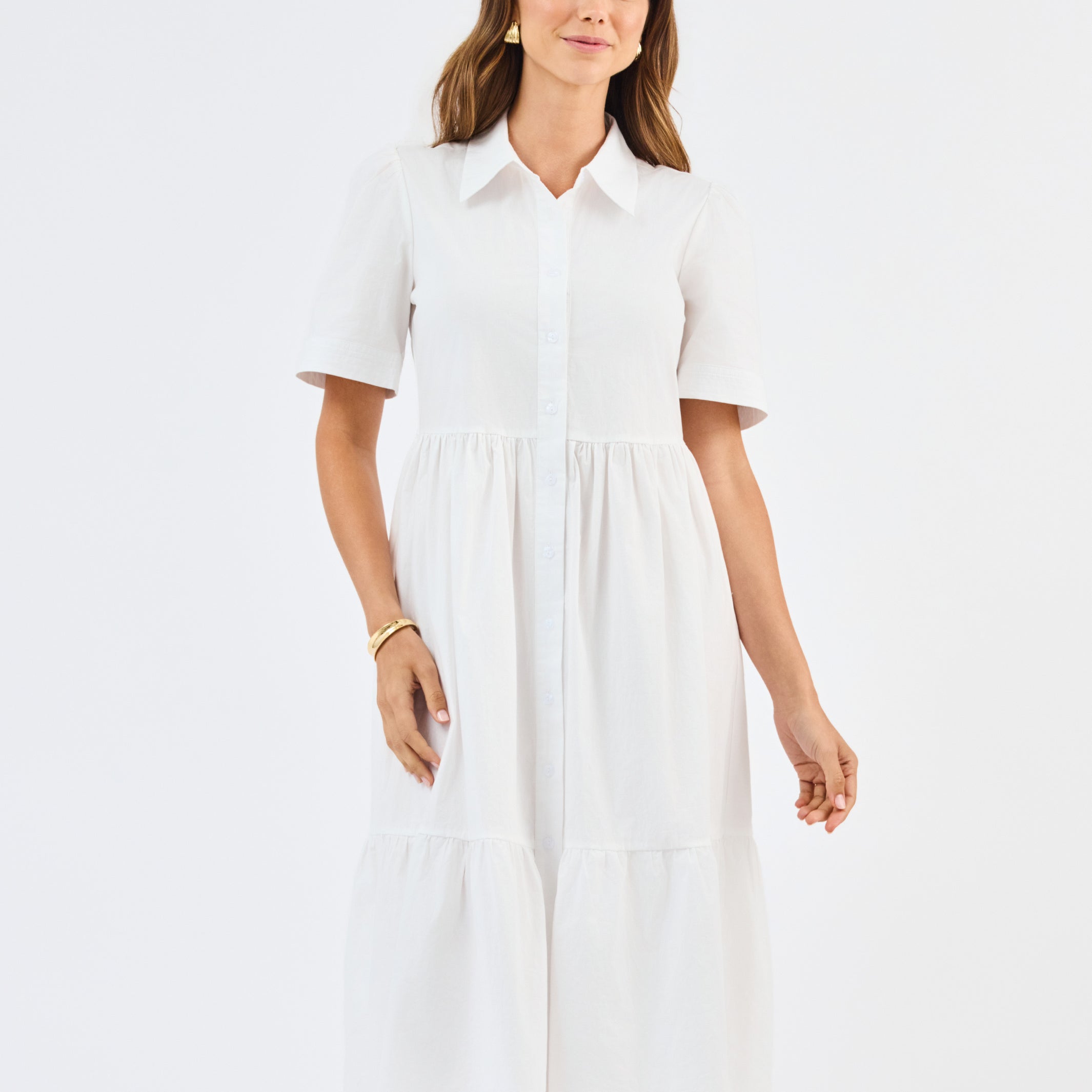 Woman wearing a white dress on a white background