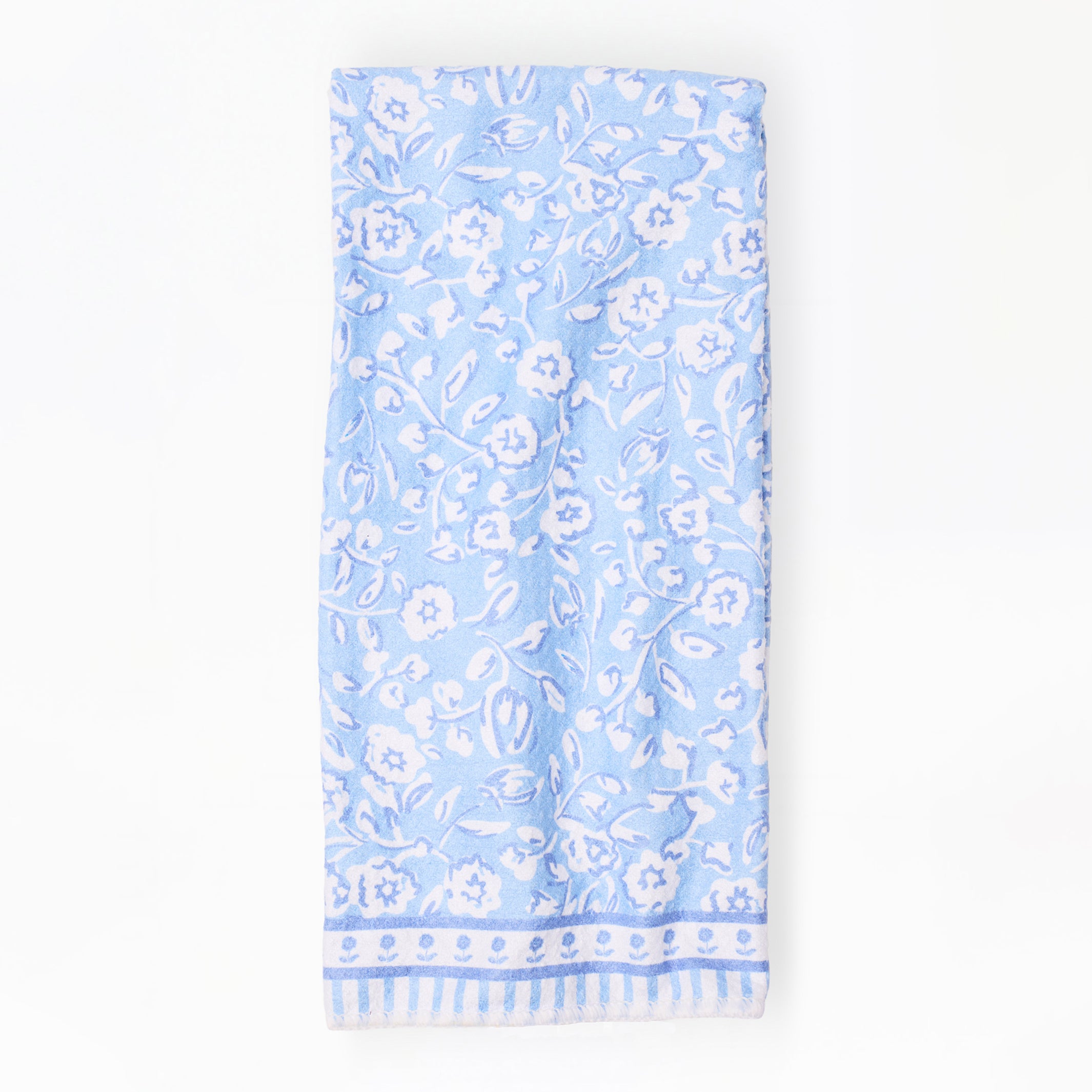 Light blue dish towel with white floral pattern on a white background