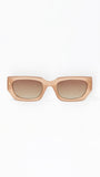 Beige sunglasses with brown gradient lenses on a white background