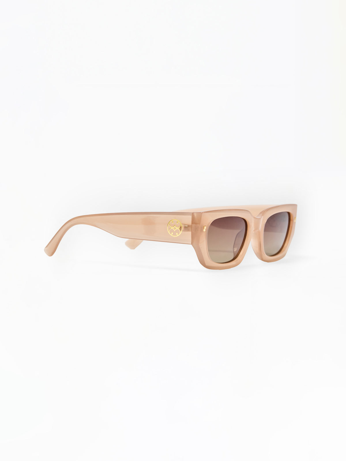 Beige/creme sunglasses on a white background
