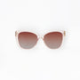 Sunglasses with a gradient brown lens on a white background