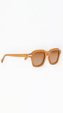 Sunglasses with a tan frame on a white background