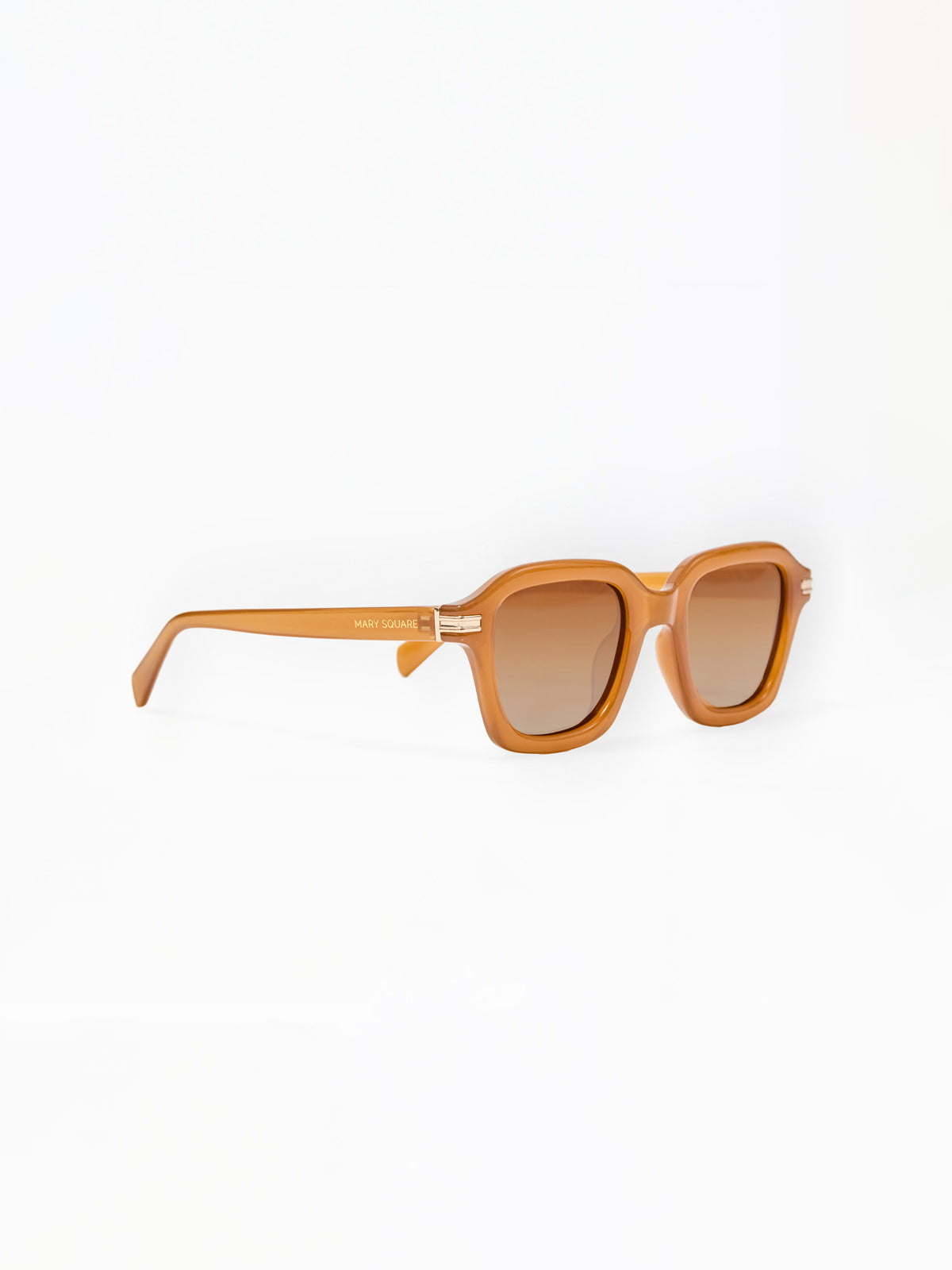 Sunglasses with a tan frame on a white background
