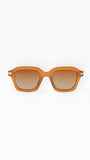 Sunglasses with a tan frame on a white background