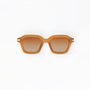Sunglasses with a tan frame on a white background
