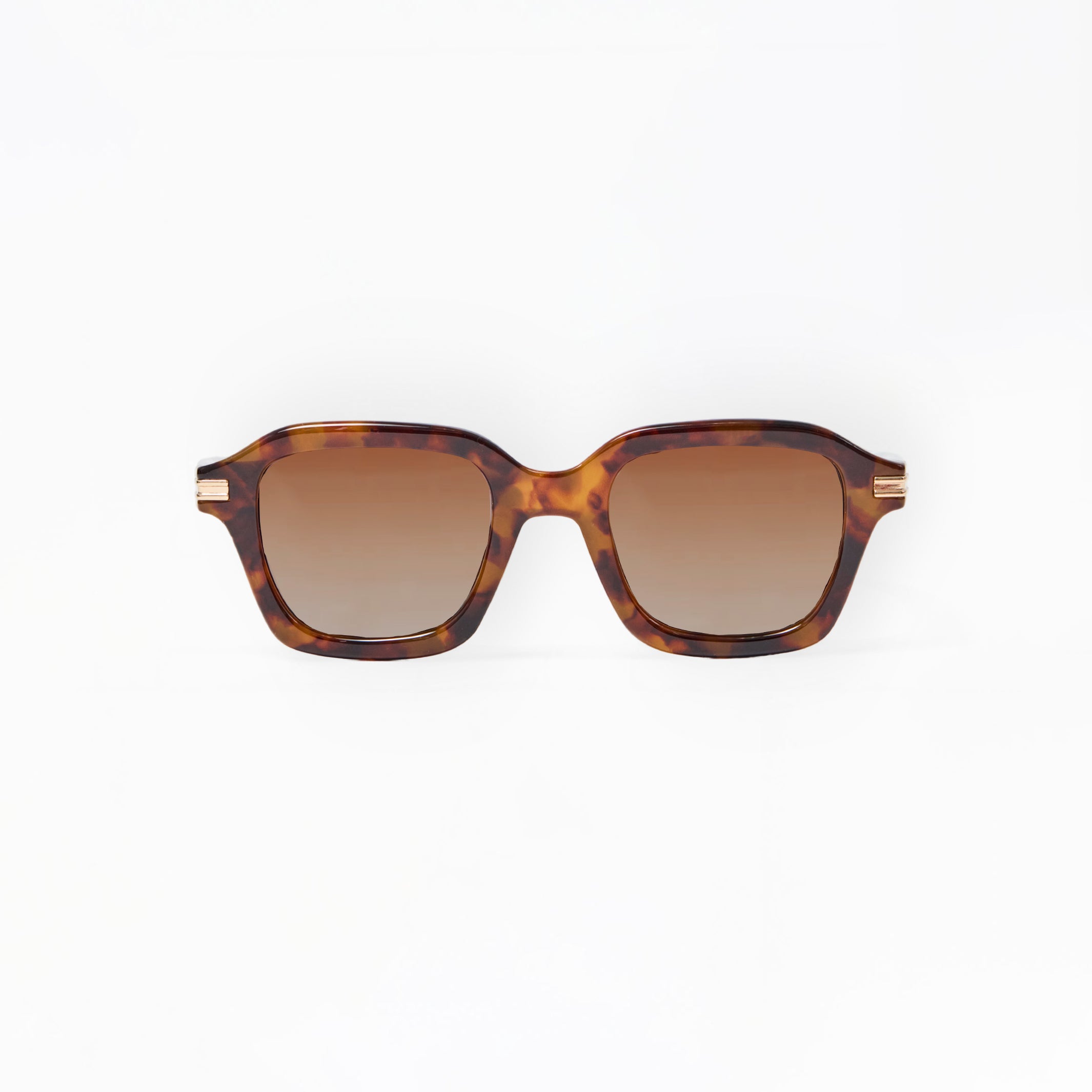 Sunglasses with tortoiseshell frame and brown lenses on a white background