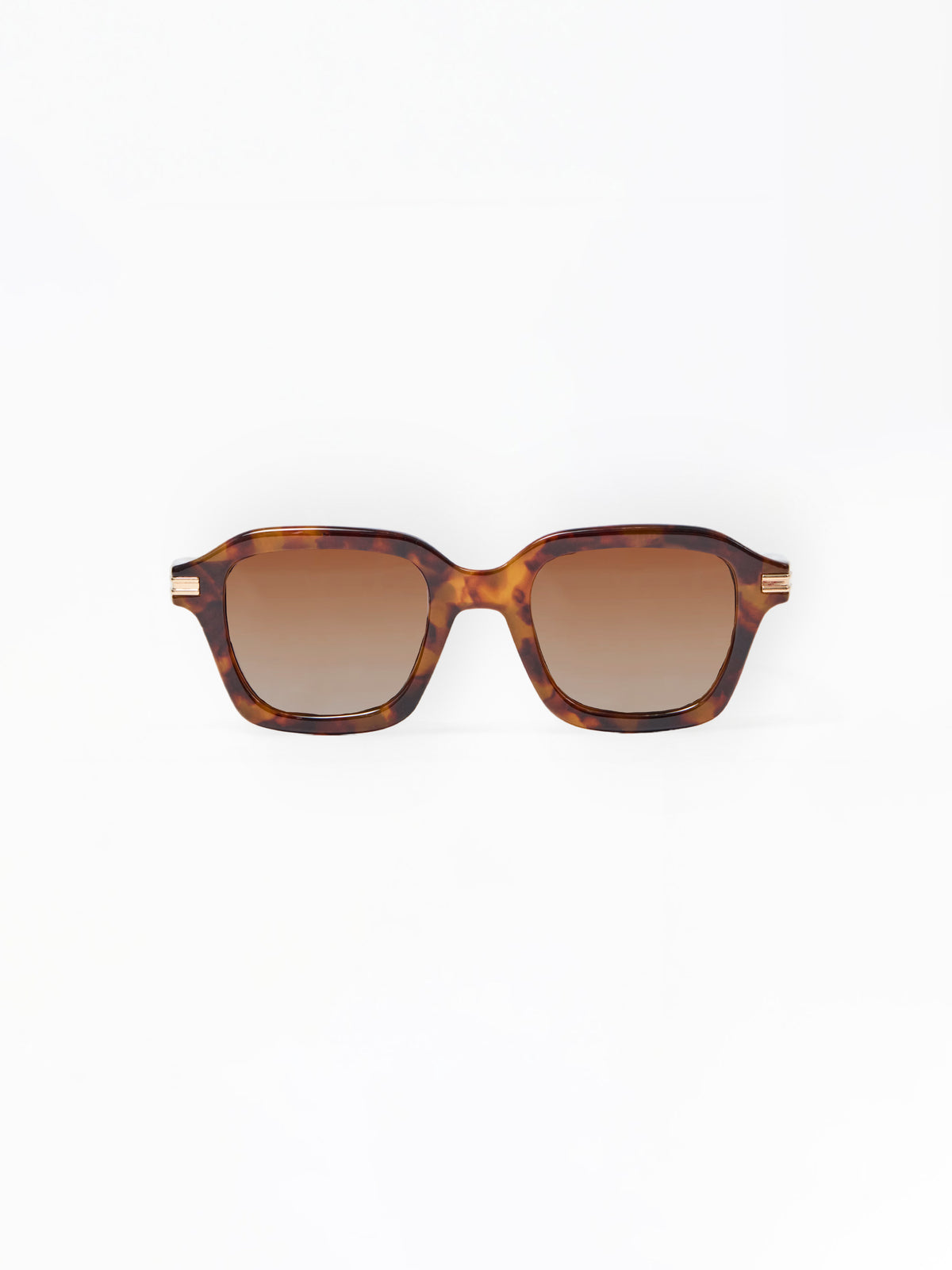 Sunglasses with tortoiseshell frame and brown lenses on a white background