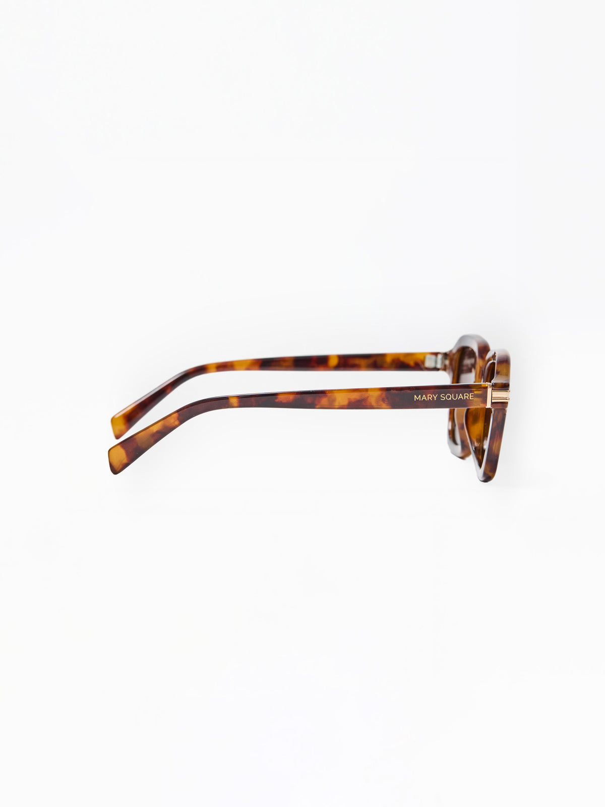 Sunglasses with tortoiseshell frame and brown lenses on a white background