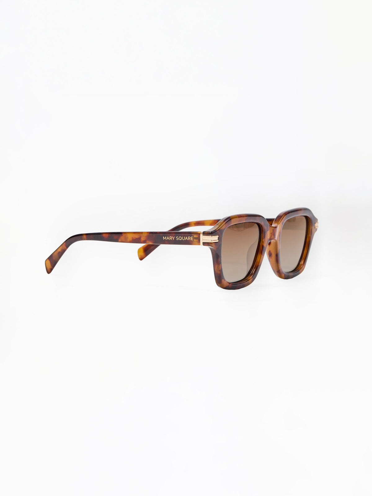 Sunglasses with tortoiseshell frame and brown lenses on a white background