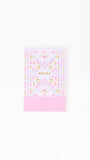 Floral notebook with 'NOTES' text on a white background