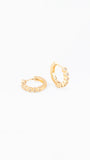 Gold hoop earrings on a white background