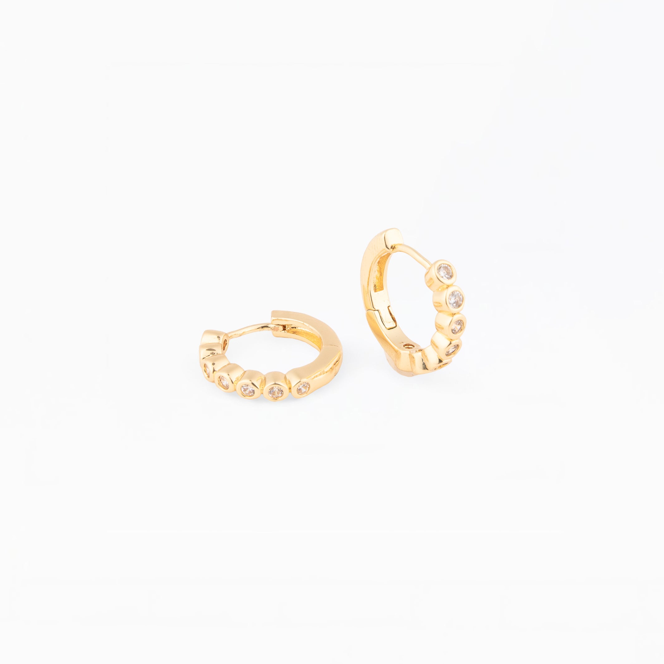 Gold hoop earrings on a white background