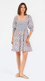 Women with short brown hair wearing a mini dress with puff sleeve lattice printed dress with pink and blue floral 
