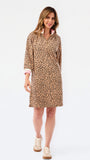 A woman modeling a leopard-print shirt dress with a pink and white striped inner collar, paired with beige platform sneakers, against a plain white studio background.