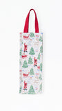 A white canvas tote bag with a festive Christmas print featuring Santa Claus, reindeer, sleighs, and green Christmas trees, complete with dark red shoulder straps, shown against a plain white background.