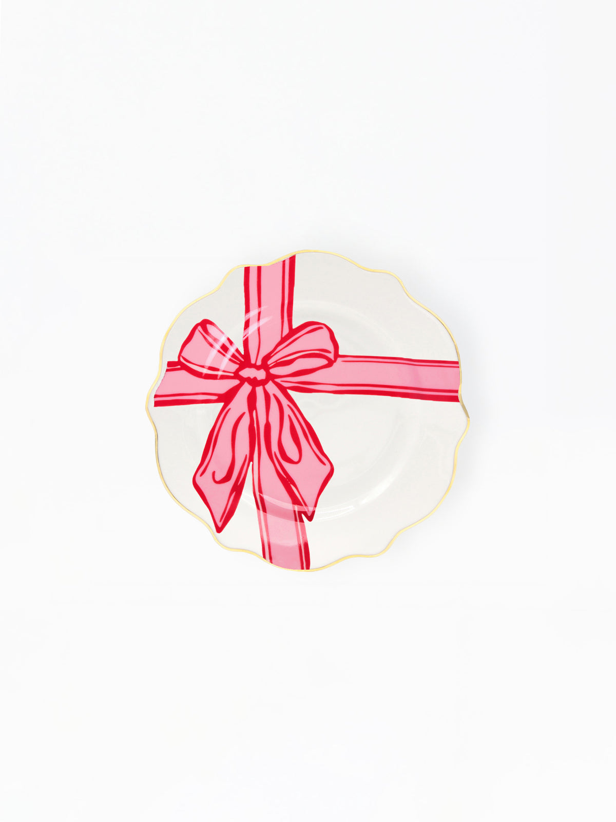 A white scalloped ceramic plate with a gold rim, decorated with a red gift box illustration featuring a red ribbon and bow, shown on a plain white background.
