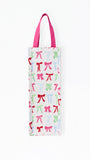 A white canvas tote bag with a repeating pattern of colorful ballet pointe shoes in pink, green, and blue, featuring magenta handles.